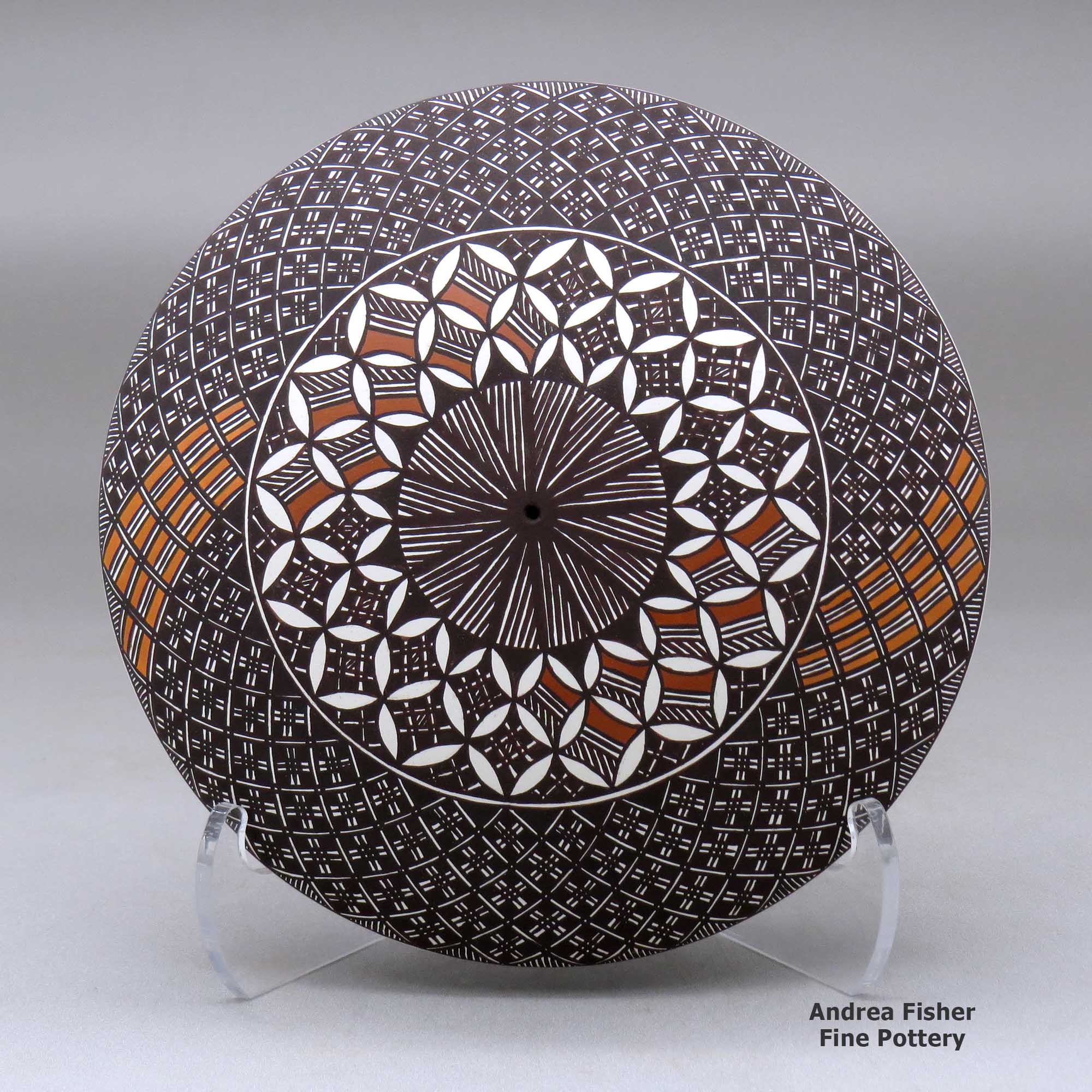Click or tap to see a larger view A black on white seed pot decorated above the shoulder with a fineline and geometric design made by Amanda Lucario of Acoma