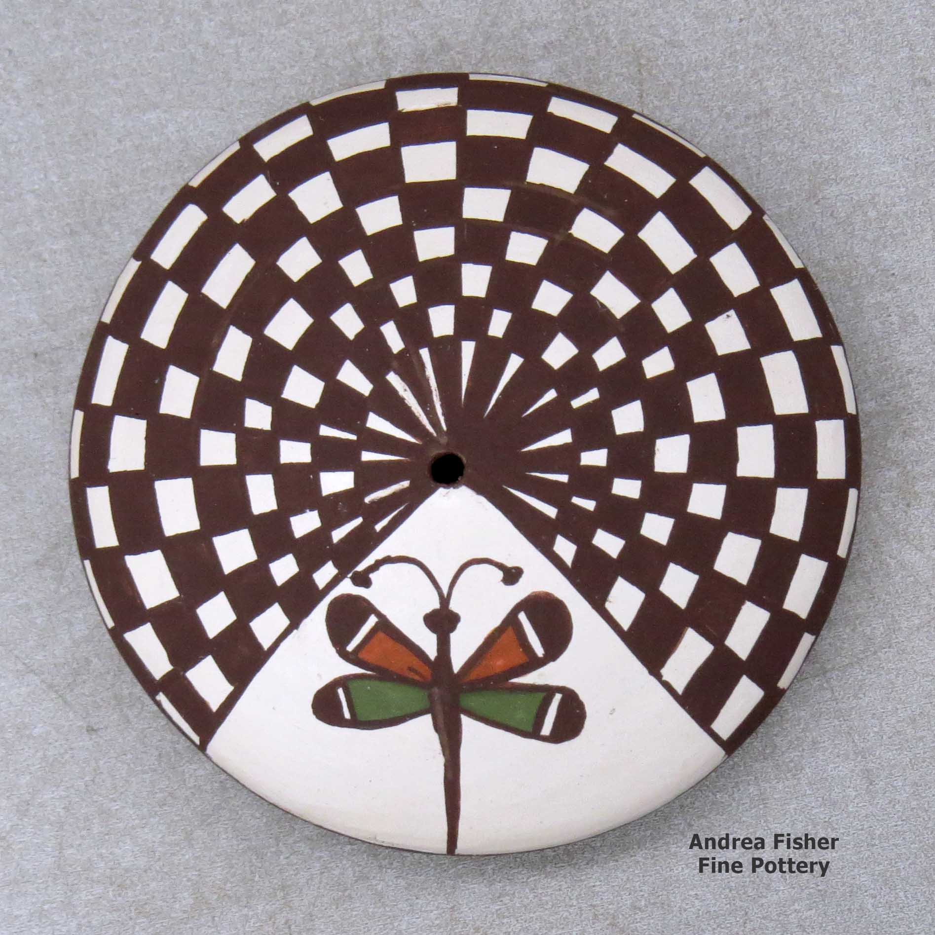 Click or tap to see a larger view A miniature polychrome seed pot decorated with a dragonfly and checkerboard geometric design above the shoulder made by Diane Lewis of Acoma