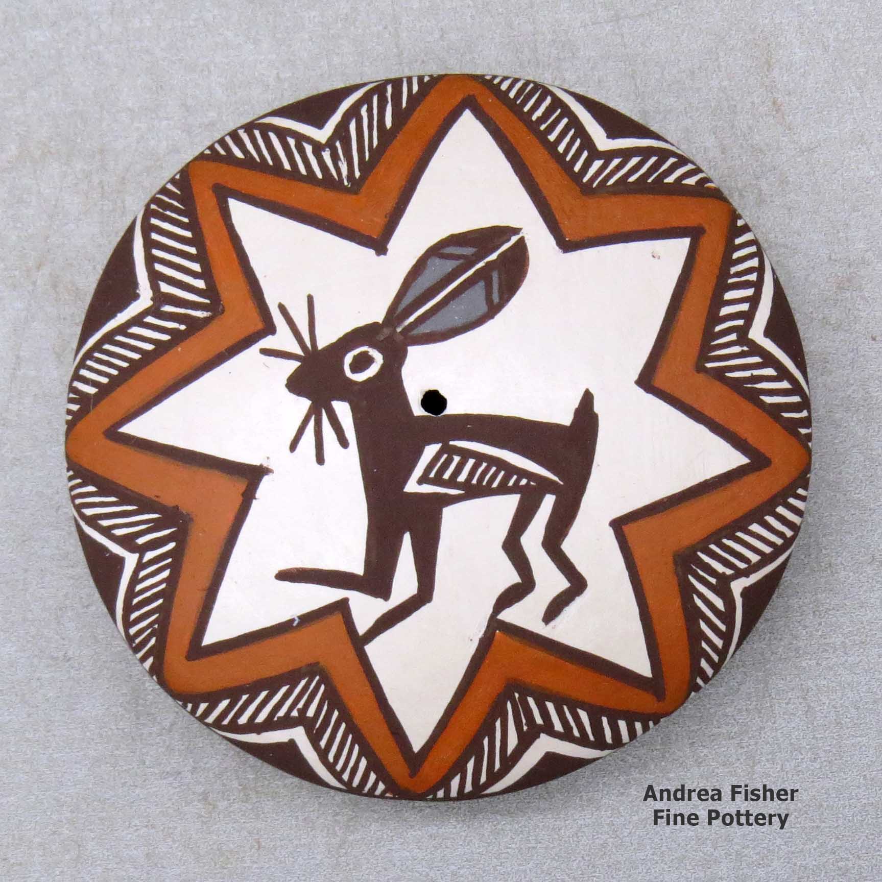Click or tap to see a larger view A miniature polychrome seed pot decorated with a Mimbres rabbit, fineline and geometric design above the shoulder made by Diane Lewis of Acoma