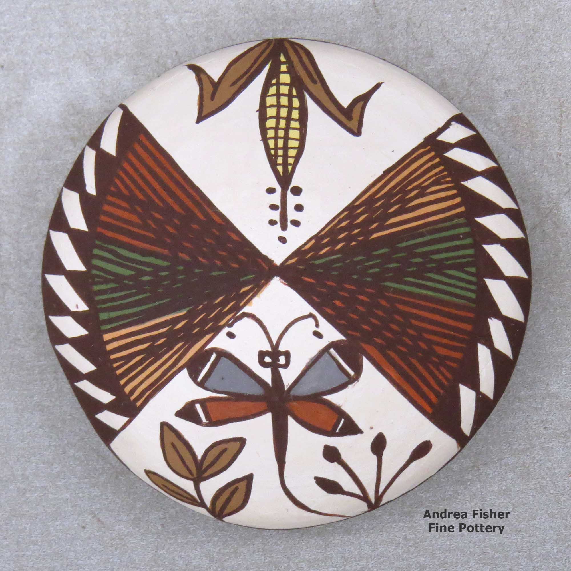 Click or tap to see a larger view A miniature polychrome seed pot decorated with a dragonfly, ear-of-corn, fineline and geometric design above the shoulder made by Diane Lewis of Acoma