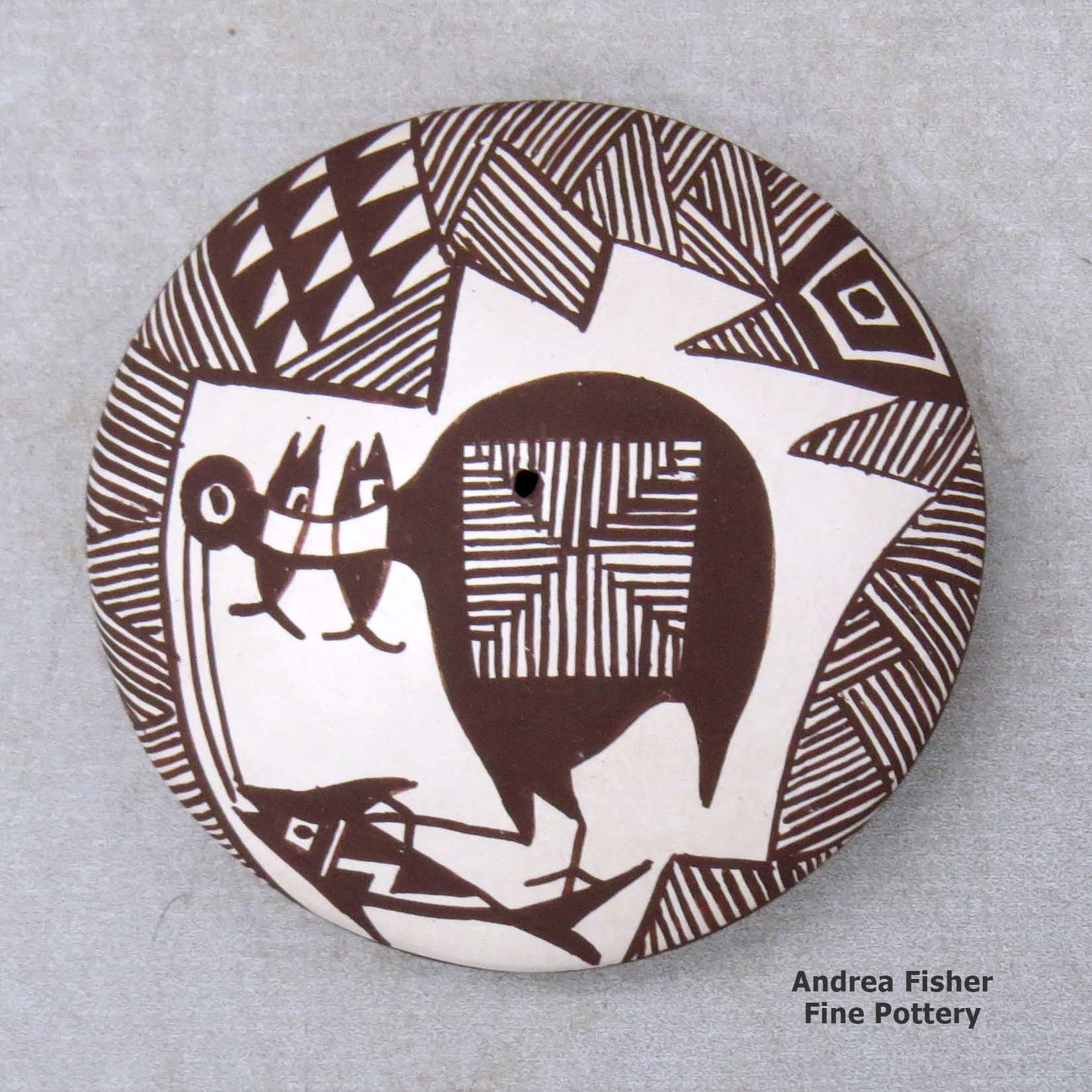 Click or tap to see a larger view A miniature black on white seed pot decorated with a cloudeater, fish, fineline and geometric design above the shoulder made by Diane Lewis of Acoma