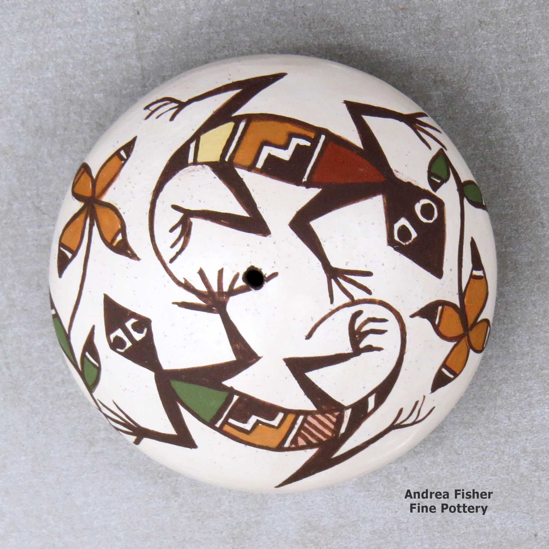 Click or tap to see a larger view A miniature polychrome seed pot decorated with a lizard, plant and geometric design above the shoulder made by Diane Lewis of Acoma