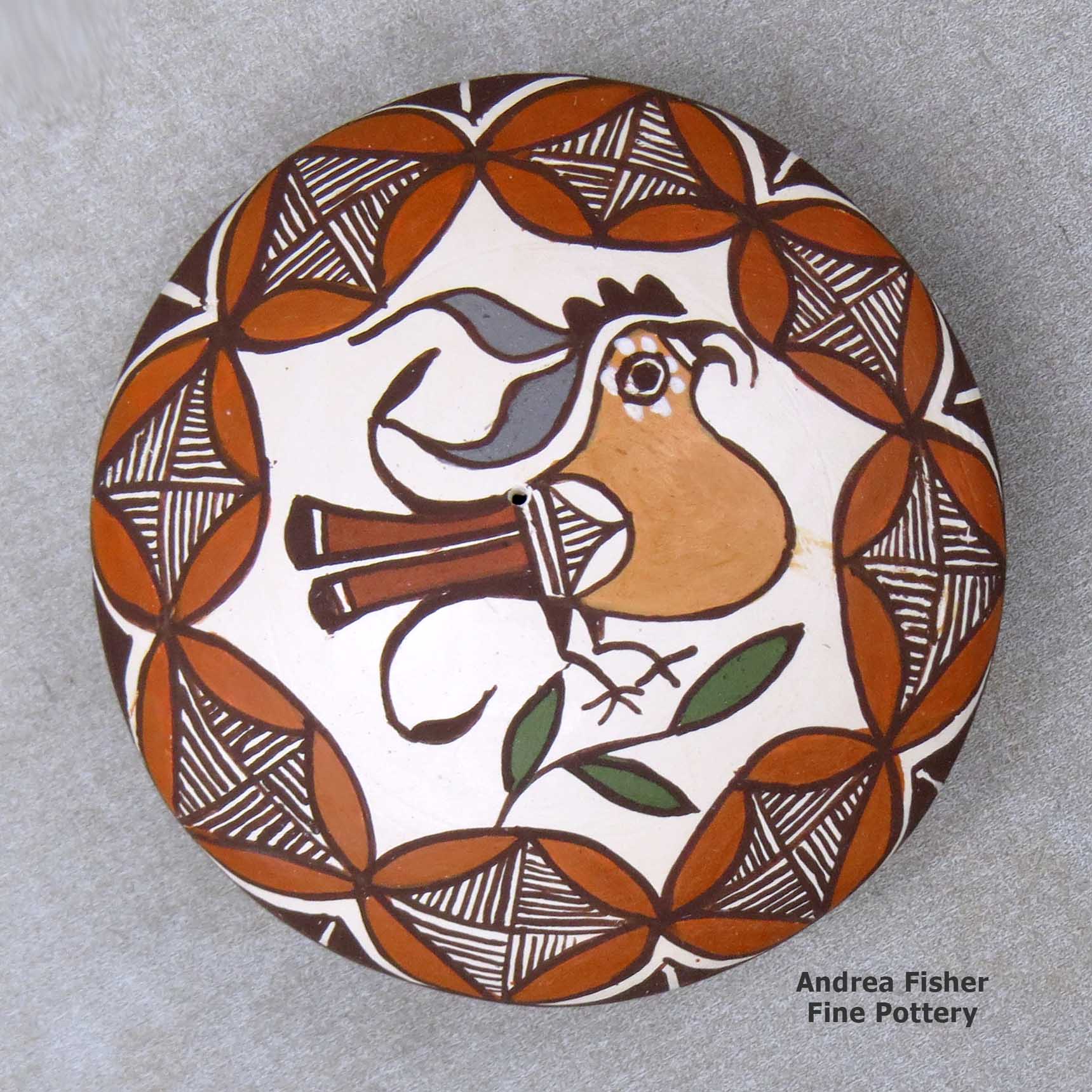 Click or tap to see a larger view A miniature polychrome seed pot decorated with a parrot, branch and geometric design above the shoulder made by Diane Lewis of Acoma