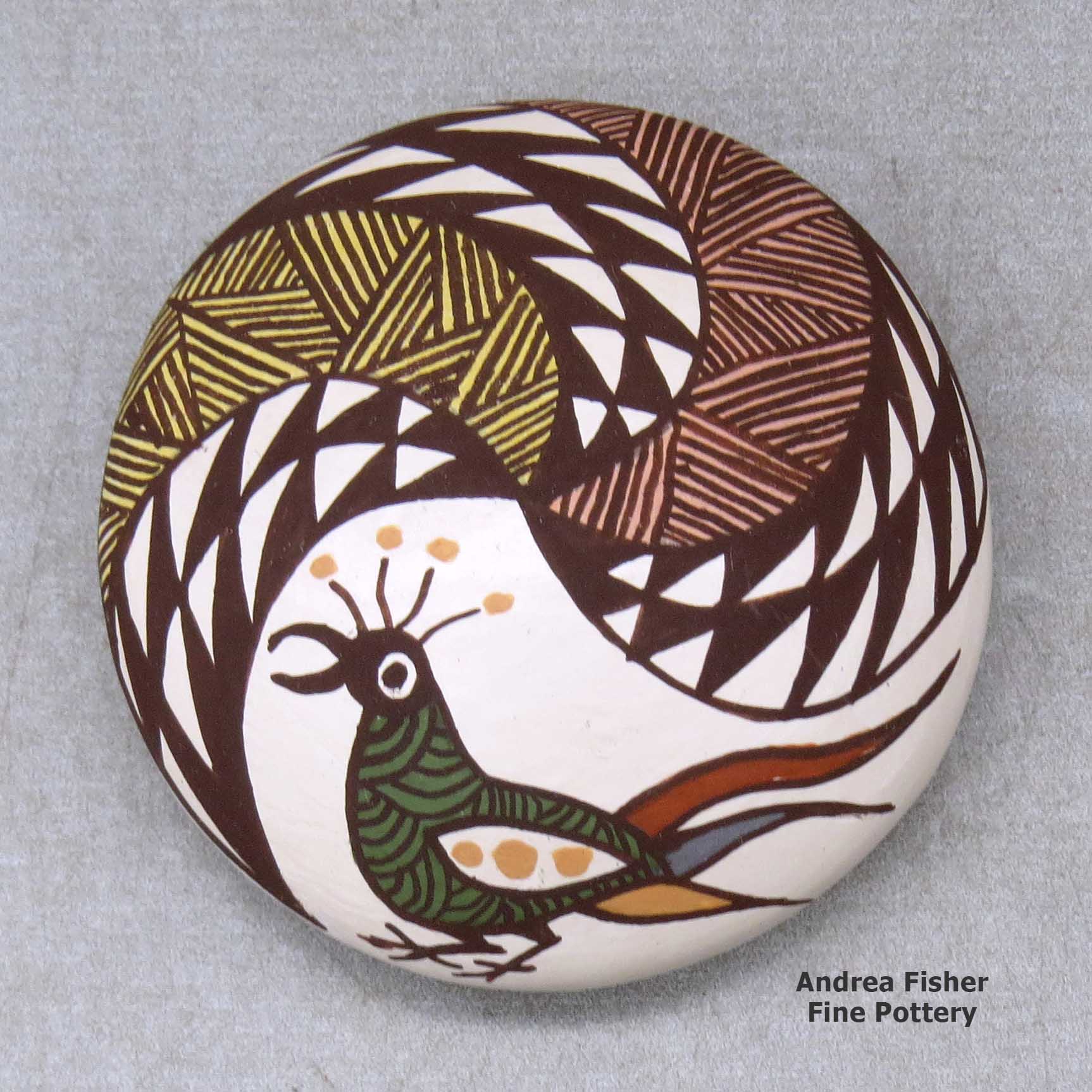 Click or tap to see a larger view A miniature polychrome seed pot decorated with a bird, fineline and geometric design above the shoulder made by Diane Lewis of Acoma