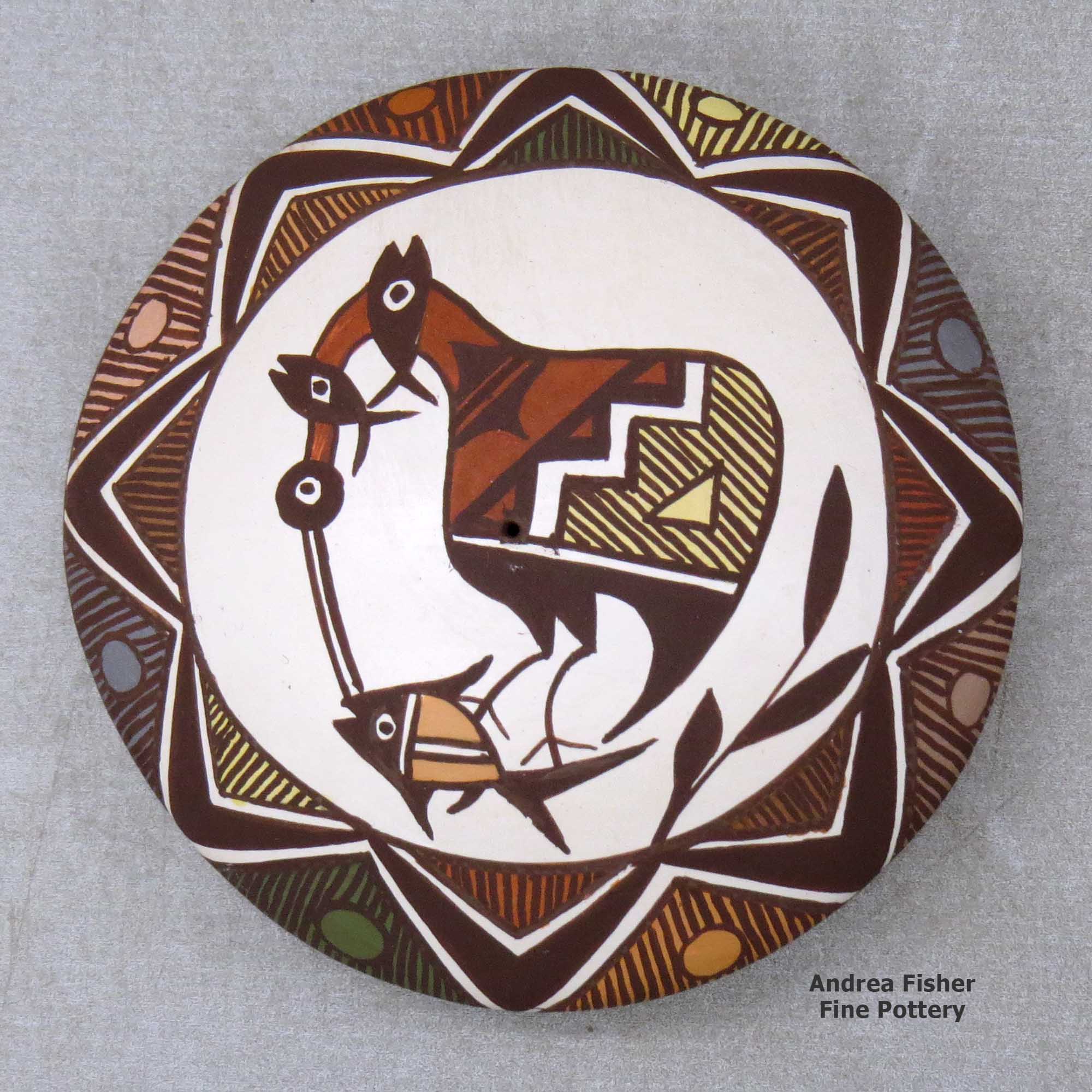 Click or tap to see a larger view A polychrome seed pot decorated with a cloudeater, fish, fineline and geometric design above the shoulder made by Diane Lewis of Acoma