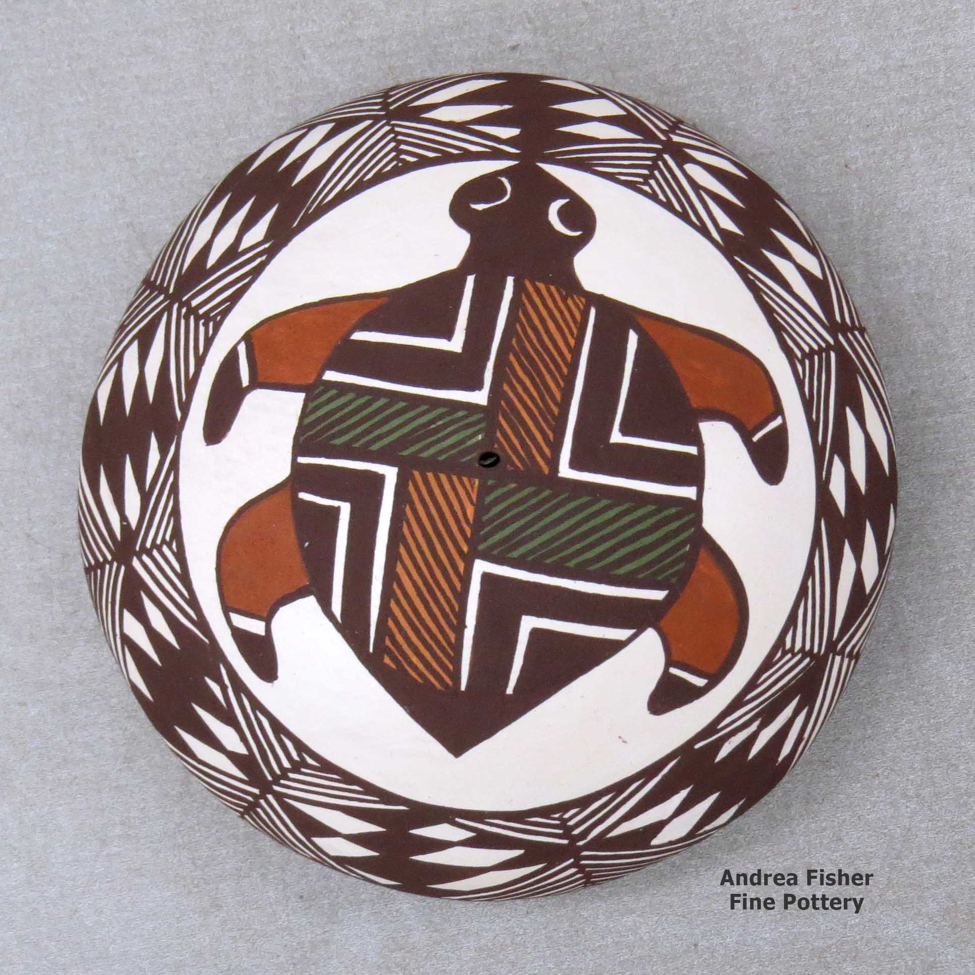 Click or tap to see a larger view A polychrome seed pot decorated with a turtle, fineline and geometric design above the shoulder made by Diane Lewis of Acoma