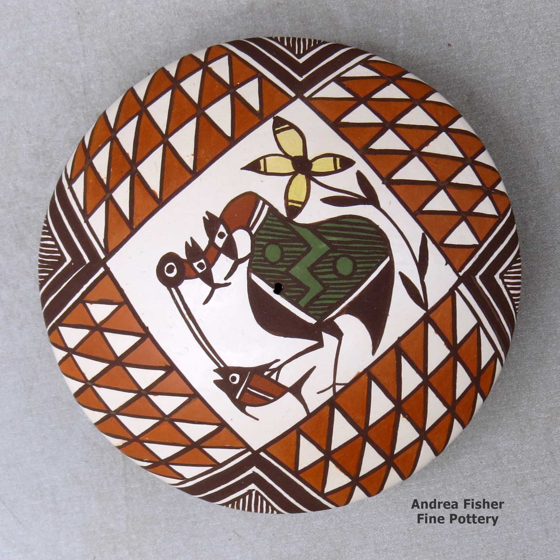Click or tap to see a larger view A polychrome seed pot decorated above the shoulder with a cloudeater, fish, flower and geometric design made by Diane Lewis of Acoma