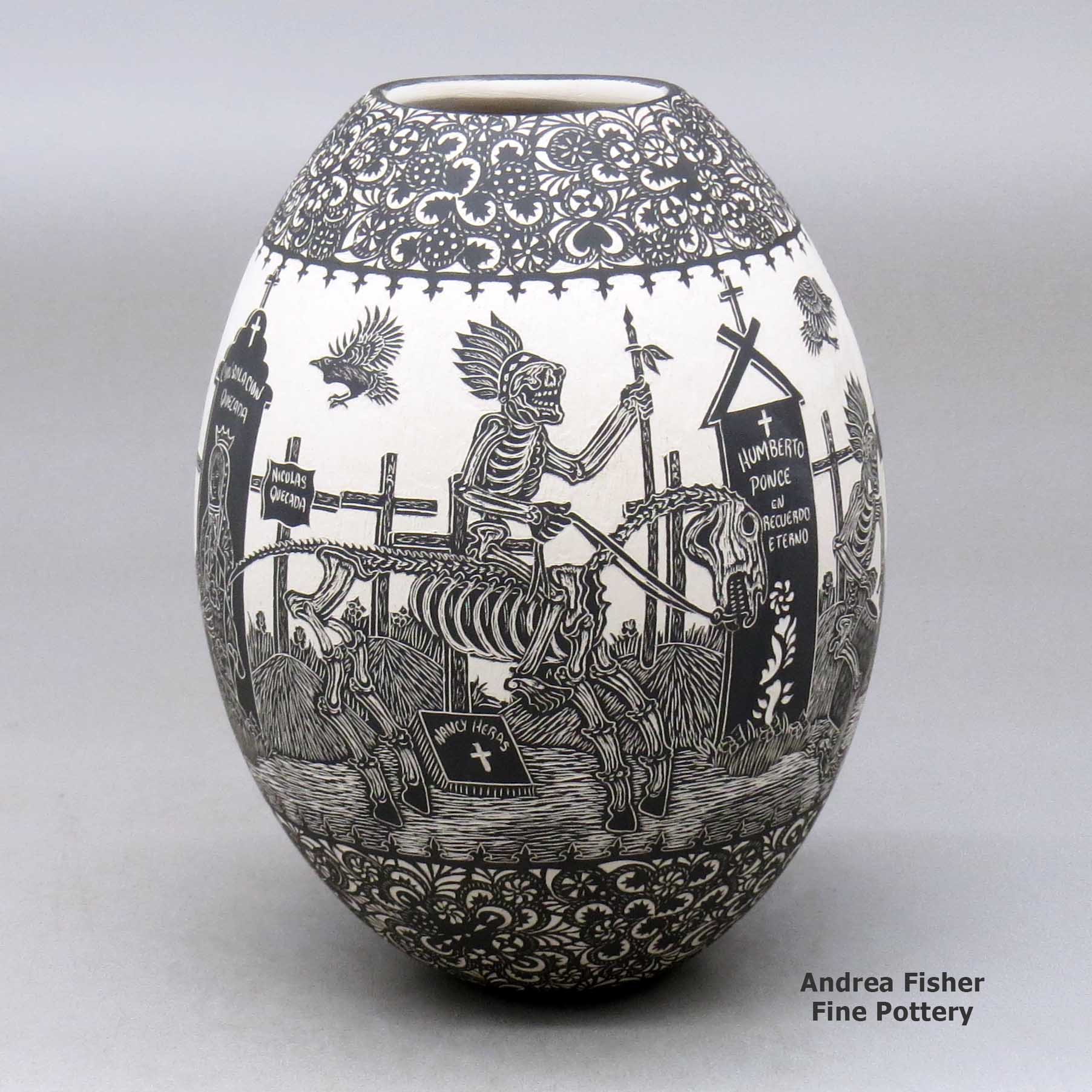 Click or tap to see a larger view A black on white jar decorated with a sgraffito Day of the Dead at the cemetery with Native Americans design made by Hector Javier Martinez of Mata Ortiz and Casas Grandes
