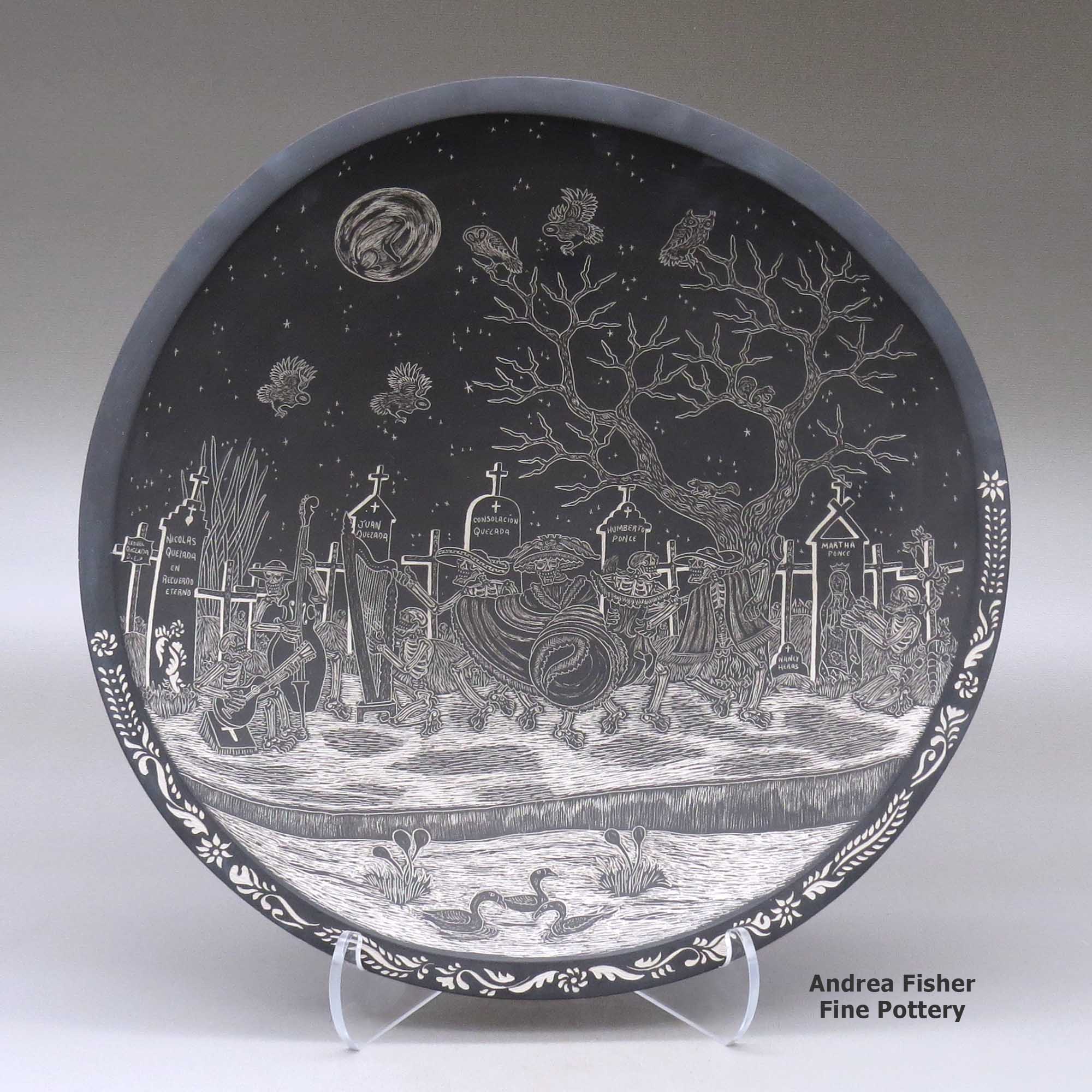 Click or tap to see a larger view A black on white shallow bowl decorated inside with a sgraffito Day of the Dead at the the Cemetery and geometric design made by Hector Javier Martinez of Mata Ortiz and Casas Grandes