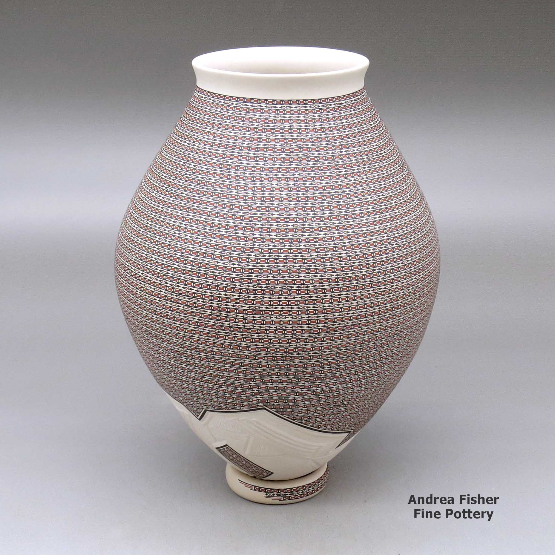 Click or tap to see a larger view A polychrome jar with a flared lip and decorated with a painted geometric design and a lightly carved geometric design around the base, with a custom matching stand made by Karla Lopez Cota of Mata Ortiz and Casas Grandes