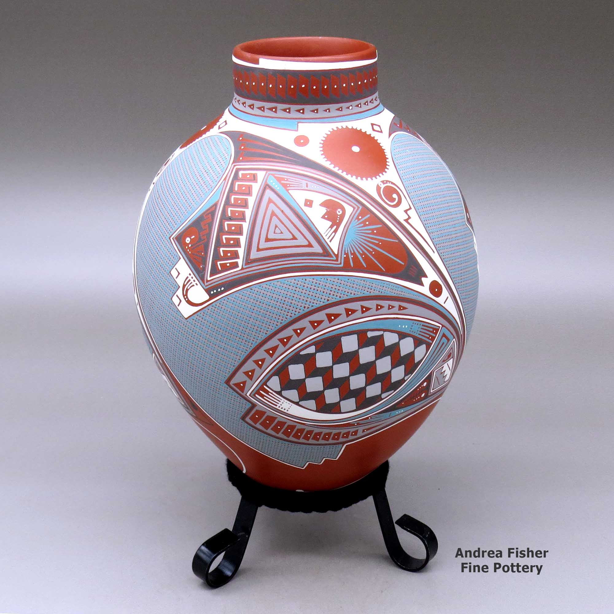 Click or tap to see a larger view A polychrome jar with a short neck and decorated with a three panel geometric design made by Rocio Silveira of Mata Ortiz and Casas Grandes