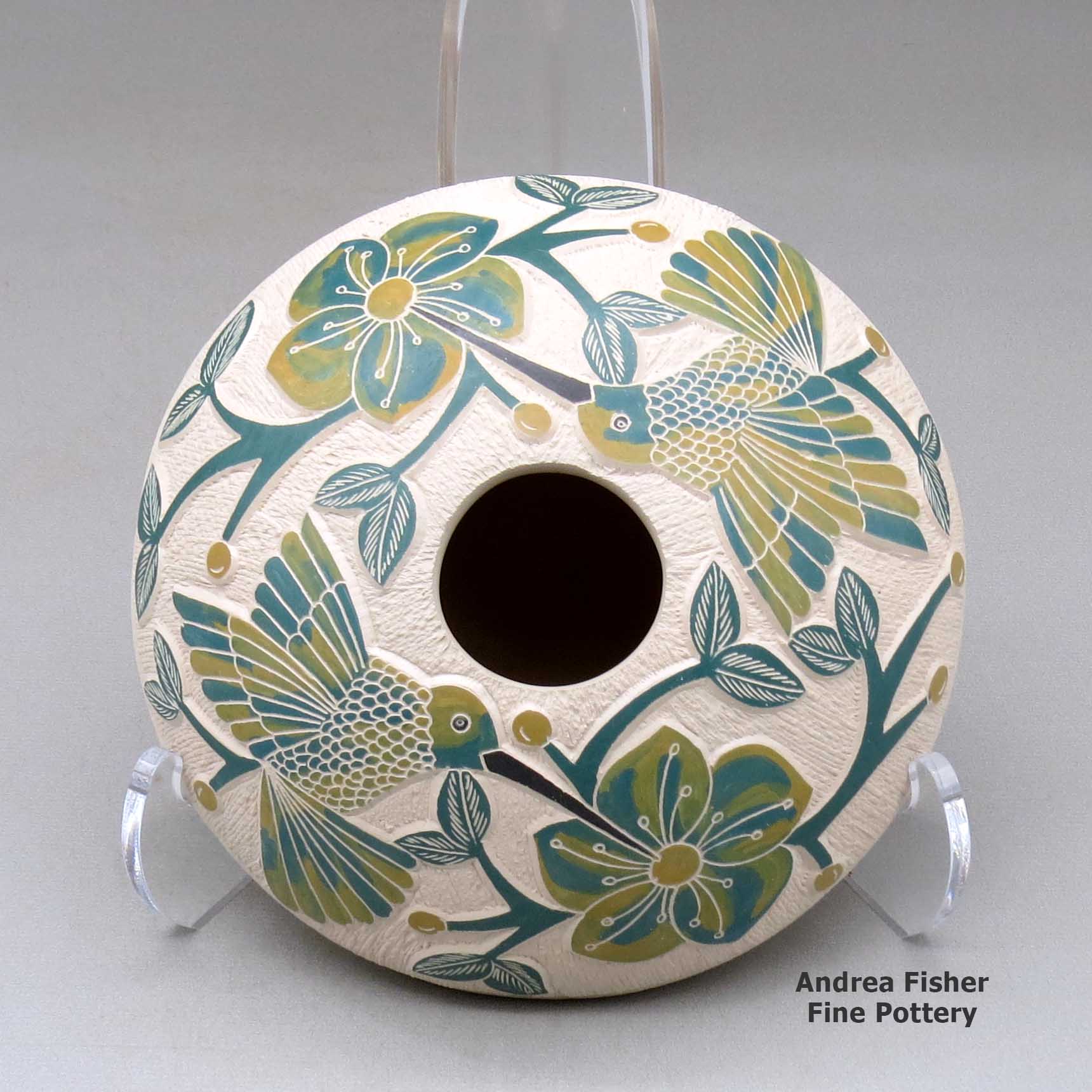 Click or tap to see a larger view A polychrome seed pot decorated with a lightly carved, sgraffito and painted hummingbird, vine, flower and berry design made by Melissa Tena of Mata Ortiz and Casas Grandes