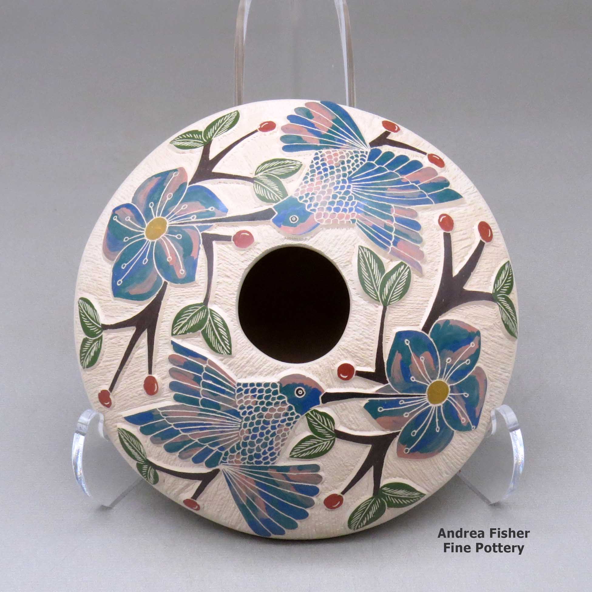 Click or tap to see a larger view A polychrome seed pot decorated with a lightly carved, sgraffito and painted hummingbird, vine, flower and berry design made by Melissa Tena of Mata Ortiz and Casas Grandes
