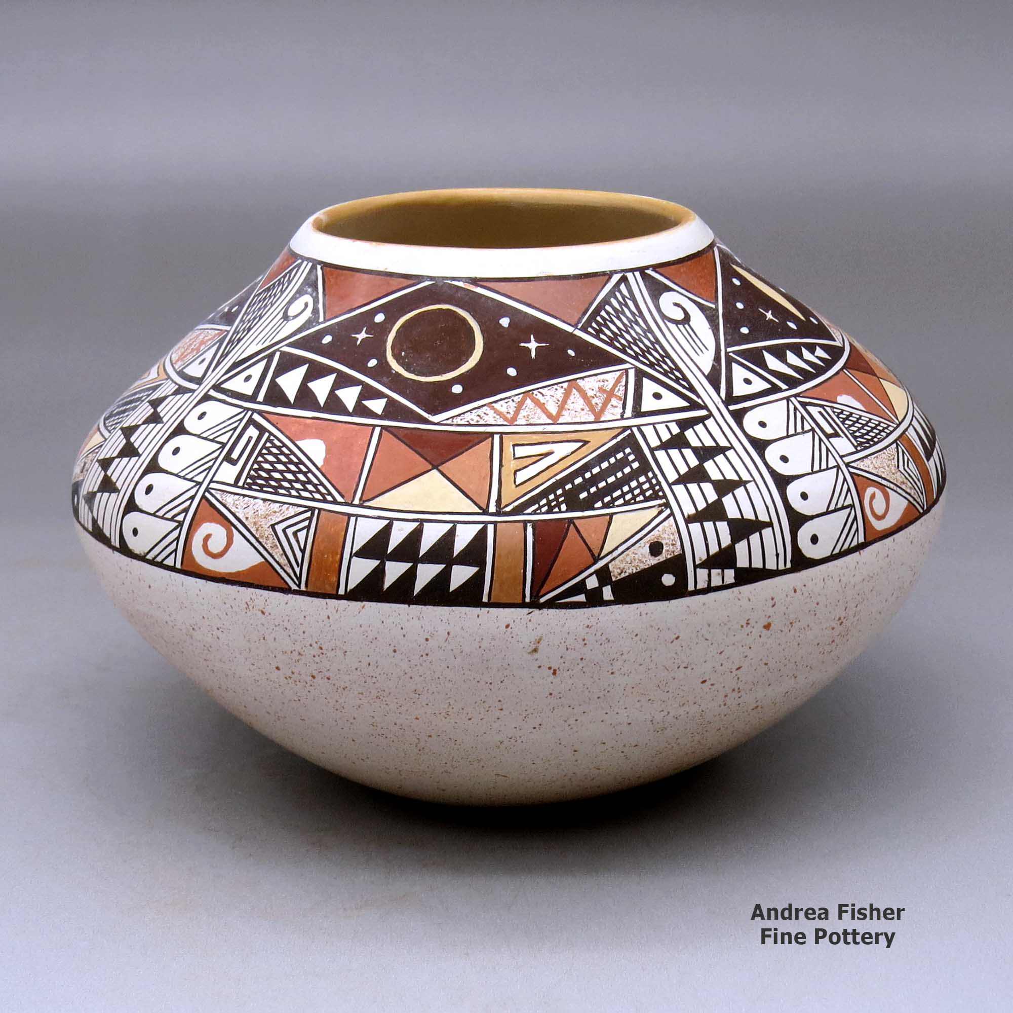 Click or tap to see a larger view A polychrome jar decorated with a four-panel phases of the moon and geometric design above the shoulder made by Rainy Naha of Hopi