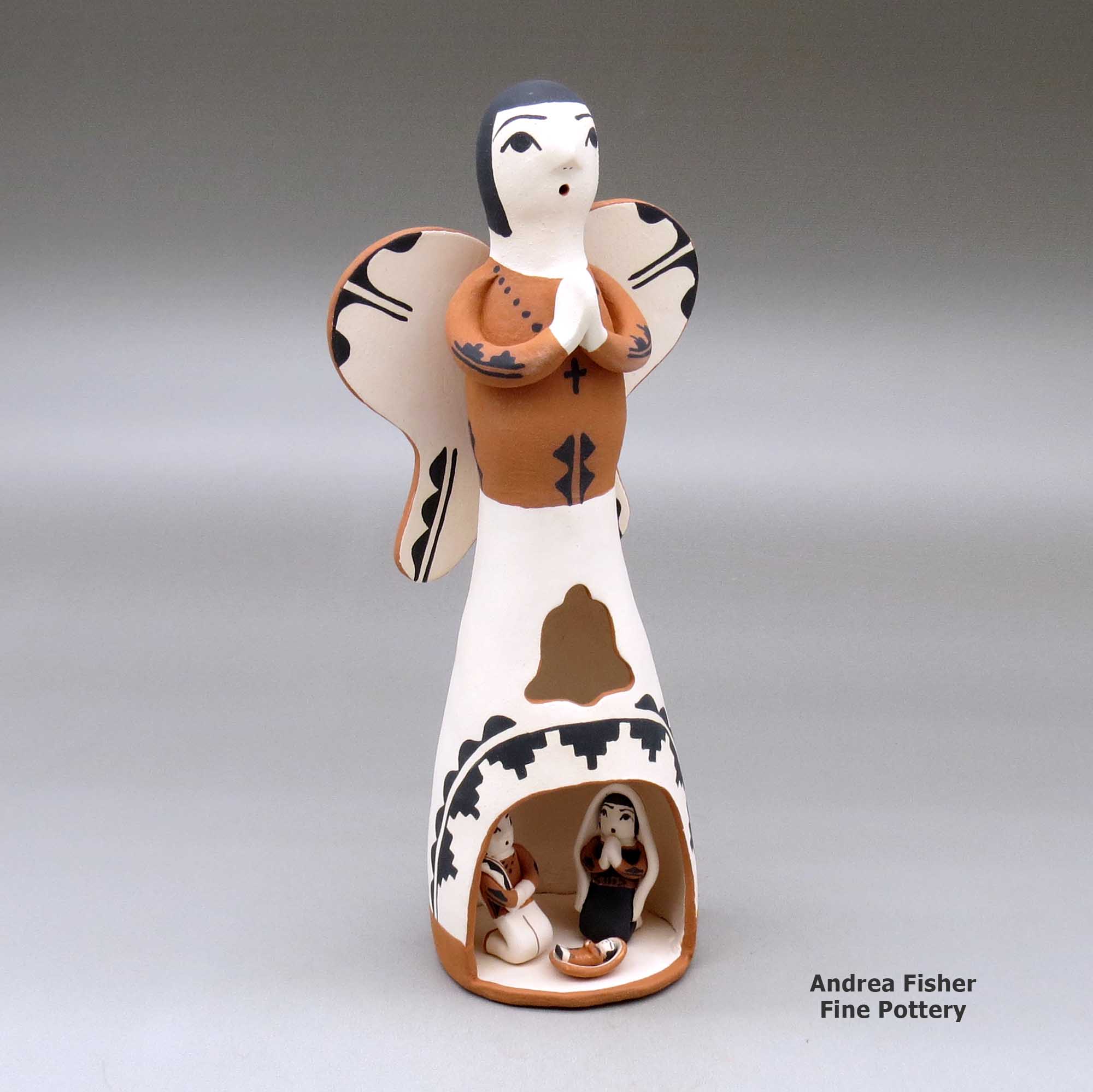 Click or tap to see a larger view A polychrome Singing Angel figure with a nativity in her skirt made by Angel Bailon of Jemez