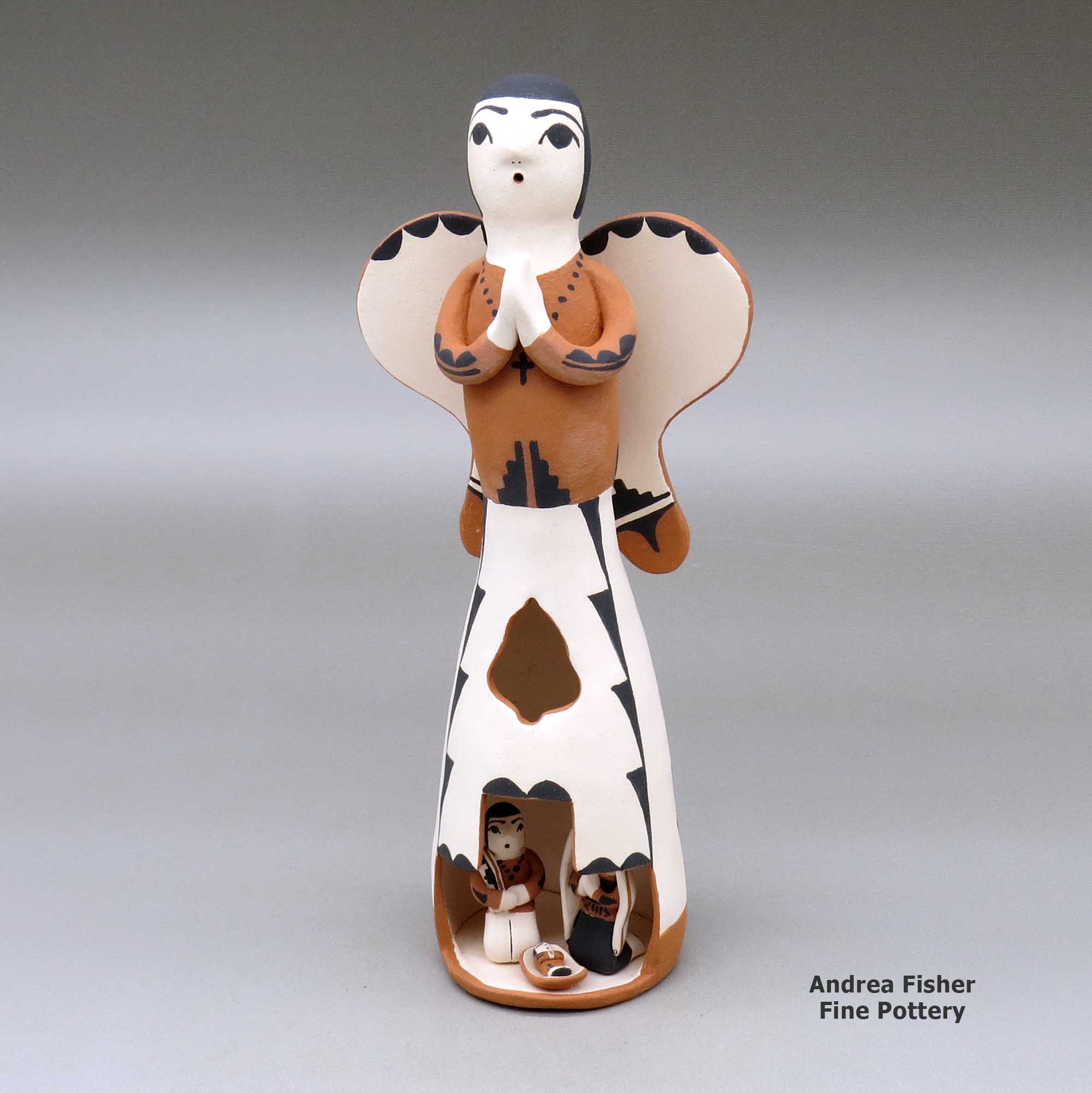 Click or tap to see a larger view A polychrome Singing Angel figure with a nativity in her skirt made by Angel Bailon of Jemez