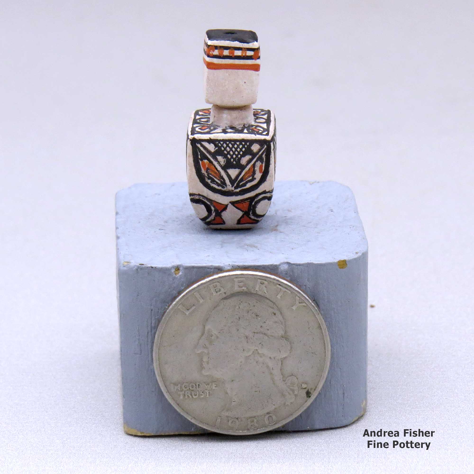 Click or tap to see a larger view A miniature lidded polychrome square jar decorated with a four-panel geometric design made by Thomas Natseway of Laguna