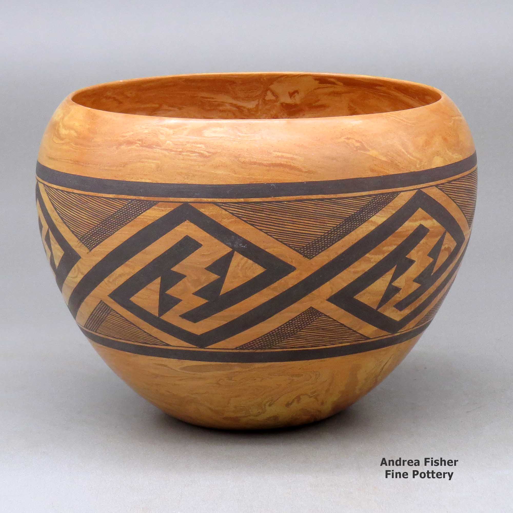 Click or tap to see a larger view A polychrome mixed clay bowl decorated with a band of fineline and geometric design around the body made by Calvin Analla Jr of Laguna