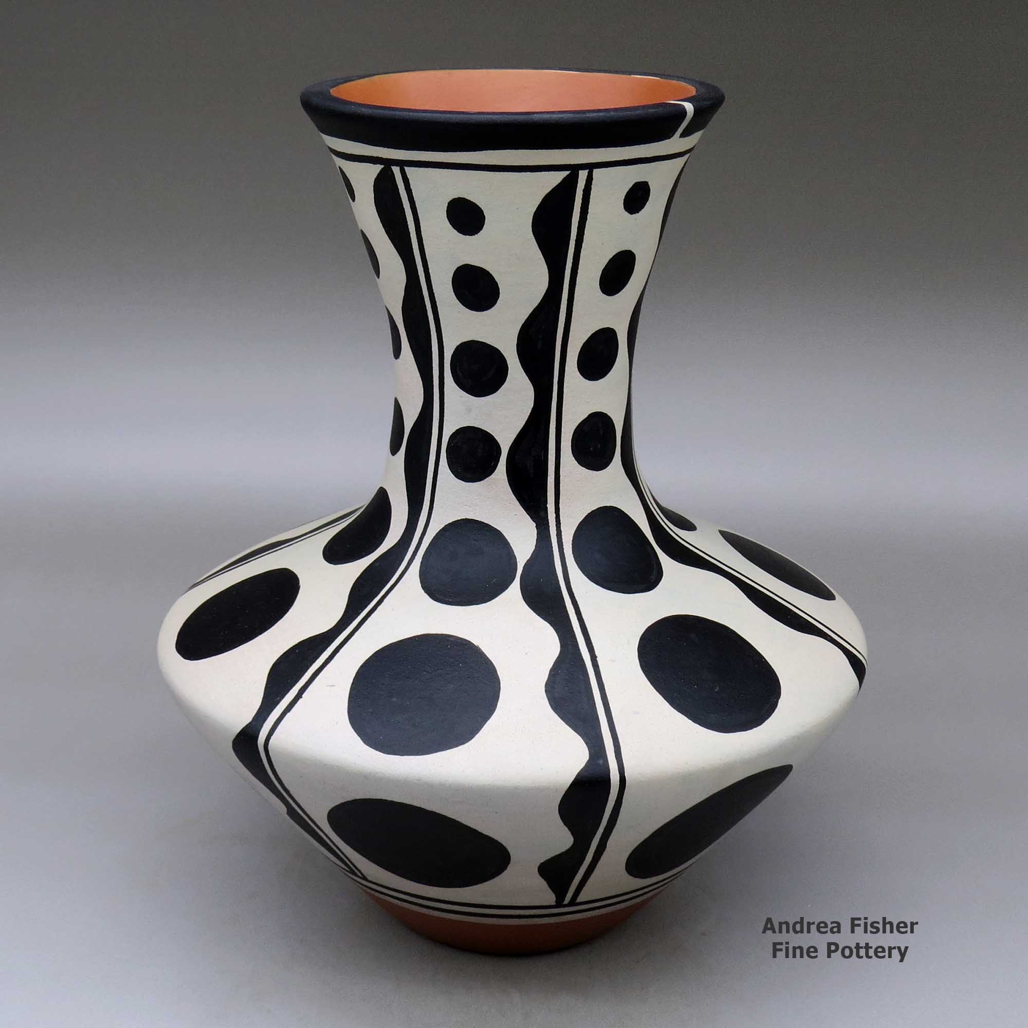 Click or tap to see a larger view A polychrome vase decorated with a six-panel geometric design made by Thomas Tenorio of Santo Domingo