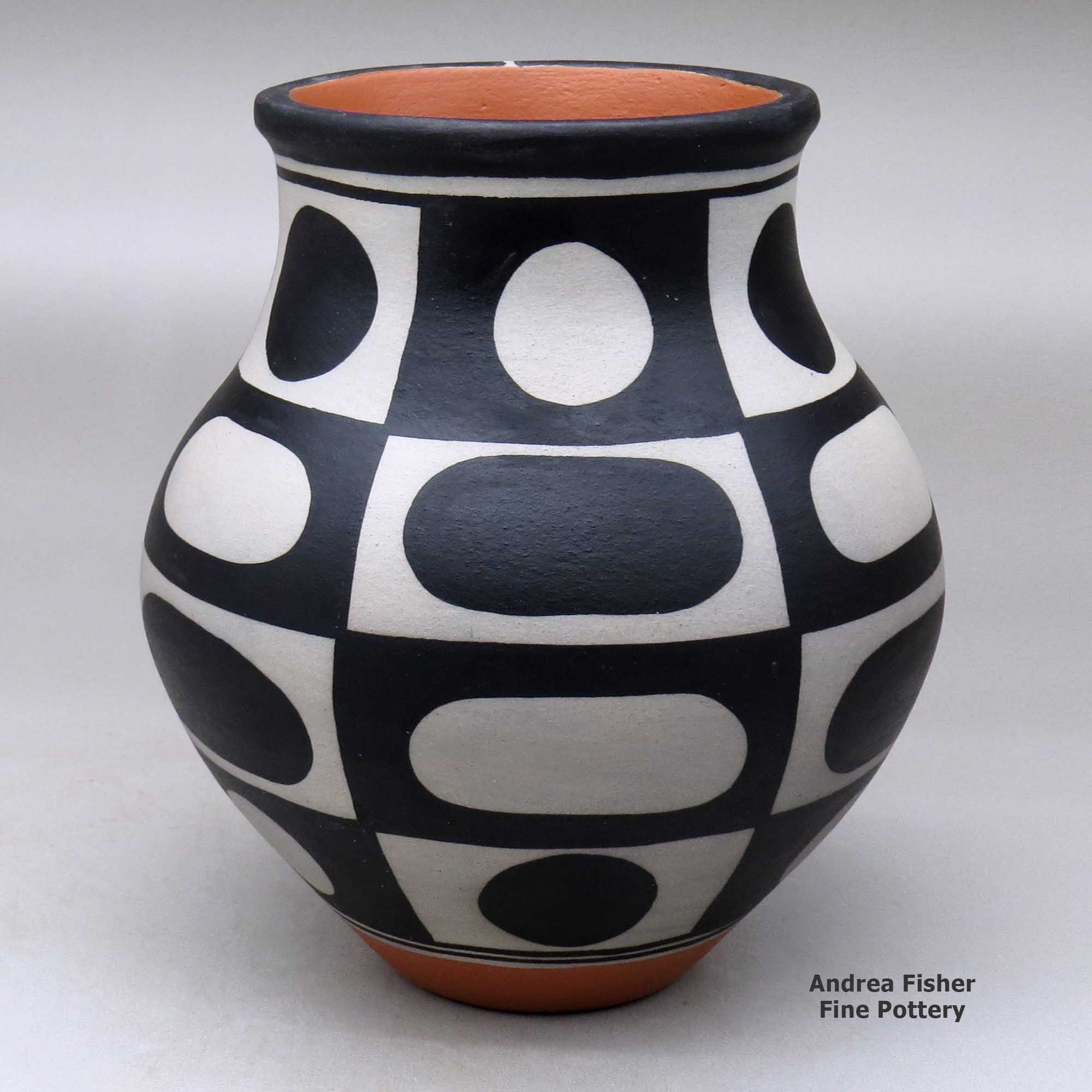 Click or tap to see a larger view A polychrome jar decorated with a six-panel geometric design made by Thomas Tenorio of Santo Domingo