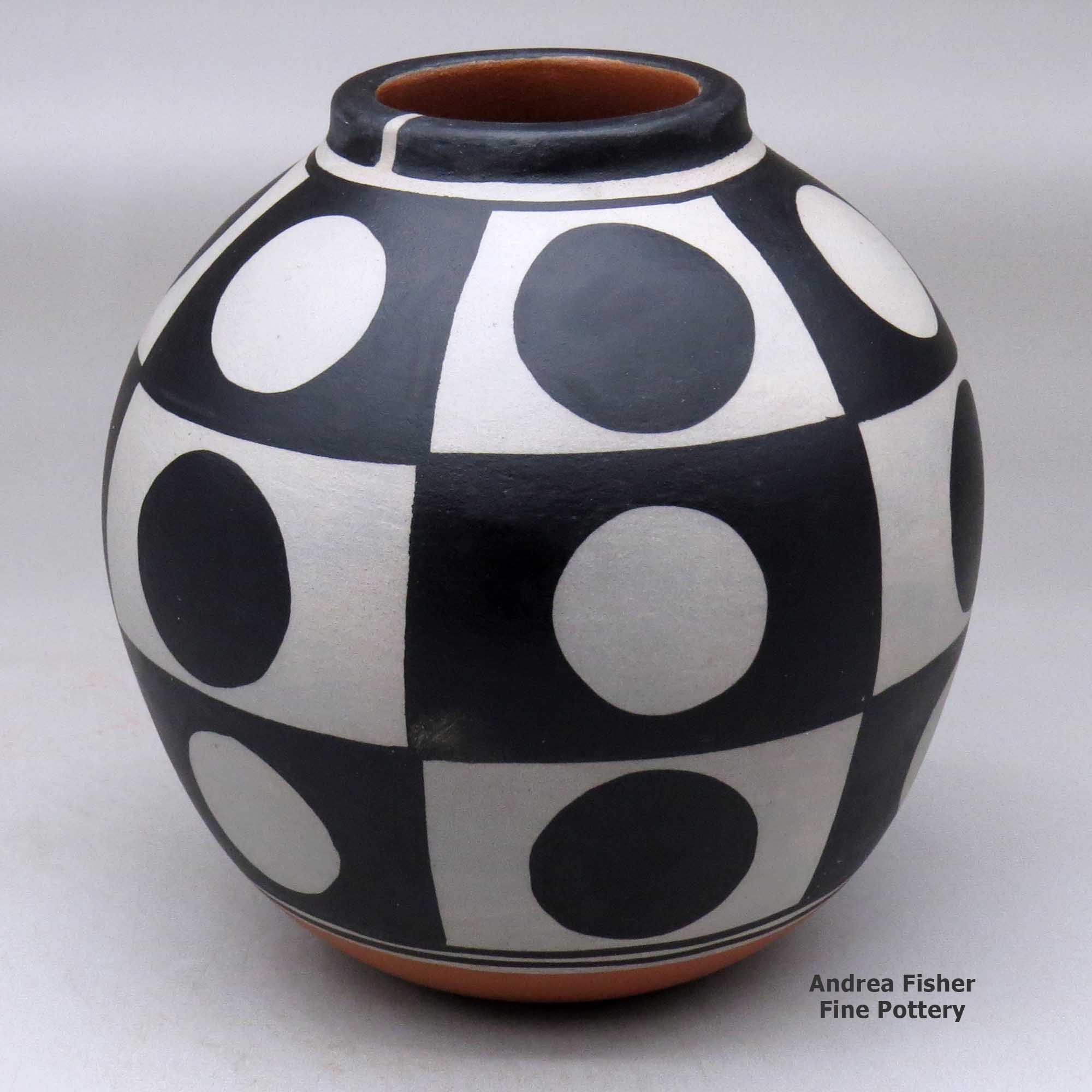 Click or tap to see a larger view A polychrome jar decorated with a six-panel geometric design made by Thomas Tenorio of Santo Domingo