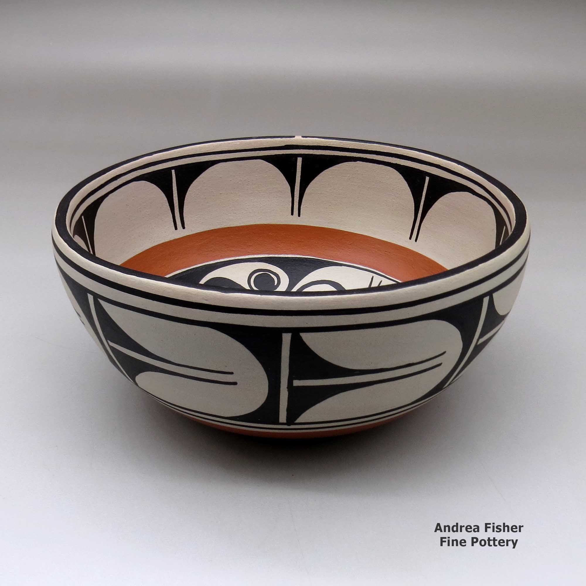 Click or tap to see a larger view A large chile bowl decorated inside with a bird, plant and geometric design, and outside with a geometric design made by Thomas Tenorio of Santo Domingo