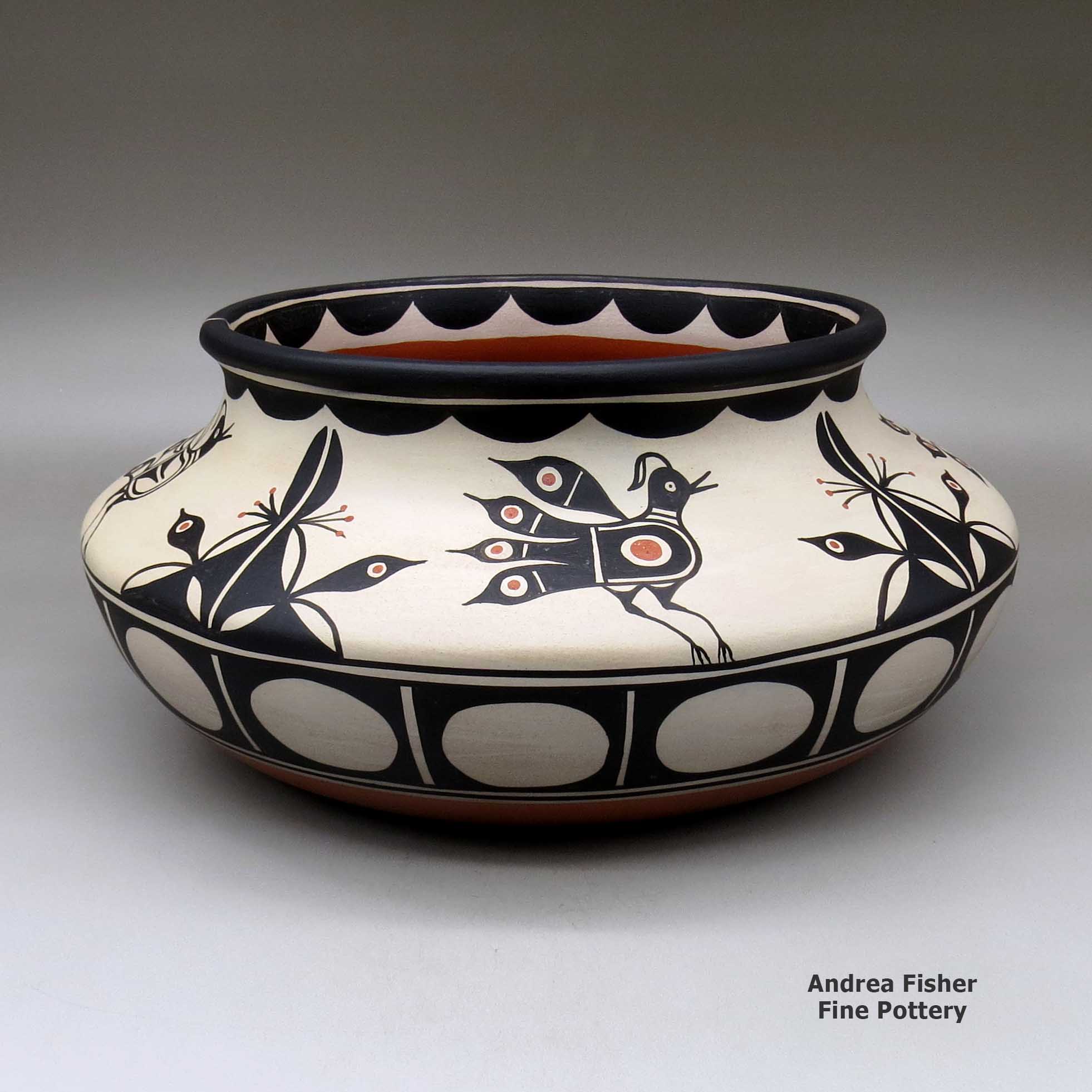 Click or tap to see a larger view A large, wide polychrome bowl with a recurved neck and decorated inside and out with a bird and geometric design made by Thomas Tenorio of Santo Domingo