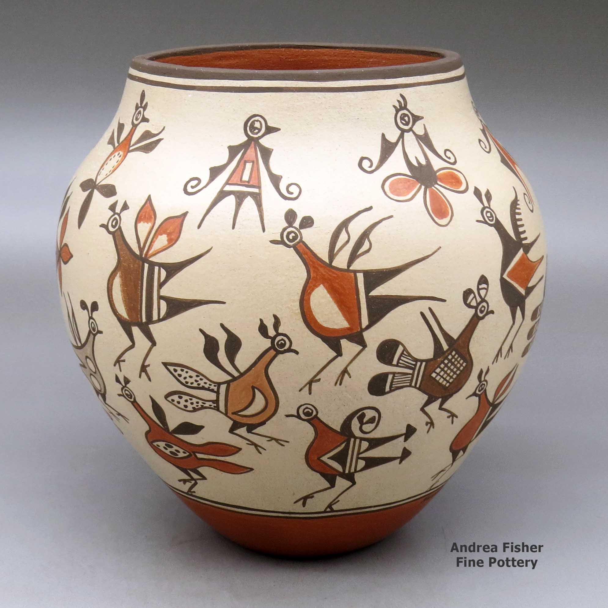 Click or tap to see a larger view A polychrome jar decorated with images of birds from throughout Zia pottery history made by Marcellus Medina of Zia