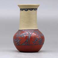 A small polychrome vase decorated with a geometric design around the shoulder, upper neck and inner rim, click or tap to see a larger version
