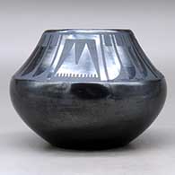 A black on black jar decorated with a four-panel feather and geometric design above the shoulder, Tag indicates it was first sold at the 1939 Golden Gate International Exposition, click or tap to see a larger version