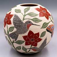 Polychrome jar with a sgraffito and painted bird, butterfly, flower, branch and leaf design
 by Sandra Lorena Arras of Mata Ortiz and Casas Grandes