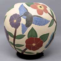 Polychrome jar with sgraffito and painted bird, branch and flower design, click or tap to see a larger version