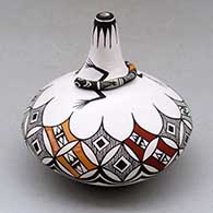 A polychrome low shouldered jar with a thin neck decorated with a lizard applique around the base of the neck and painted with a geometric design around the shoulder
 by Carolyn Concho of Acoma