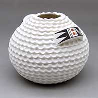 A corrugated white jar decorated with a polychrome geometric design on the handles
 by Jackie Shutiva of Acoma