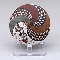 A small polychrome seed pot decorated with a kokopelli, corn plant, fineline and geometric design
 by Diane Lewis of Acoma
