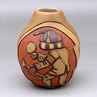 A polychrome jar decorated with a two panel carved and painted masked Hopi dancers and geometric design
 by Elvira Nampeyo of Hopi