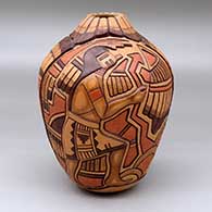 A polychrome jar carved and painted with a masked Hopi dancer, feather and geometric design
 by Thomas Polacca of Hopi