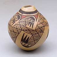 A small polychrome jar with an organic opening and decorated around the body with a migration pattern design
 by Miriam Nampeyo of Hopi