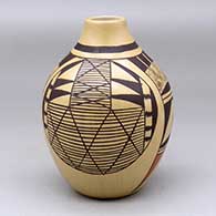 A polychrome jar decorated with a four panel bird element, migration pattern and geometric design
 by Carla Nampeyo of Hopi
