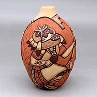 Click for a larger view A polychrome jar decorated with a carved and painted Hopi dancer, feather and geometric design
 by Carla Nampeyo of Hopi