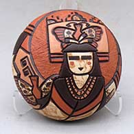 A polychrome seed pot decorated with a carved, sgraffito and painted butterfly woman dancer and geometric design
 by Delmar Polacca of Hopi