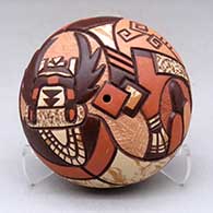 A polychrome seed pot decorated with a carved, sgraffito and painted butterfly pueblo dancer and geometric design
 by Delmar Polacca of Hopi