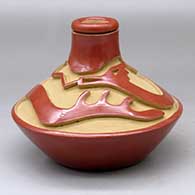 Click for a larger view A low shouldered red jar with a thin neck and carved above the shoulder with an avanyu design
 by Anna Archuleta of Santa Clara