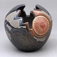 A black bowl with sienna spots and a four panel kiva step carved opening plus a sgraffito medallion, feather, hummingbird, flower and geometric design
 by Vickie Martinez of Santa Clara