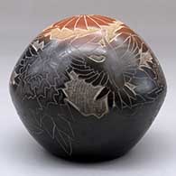 A black seed pot with a large sienna spot and decorated with a sgraffito hummingbird, flower, leaf, vine and geometric design, click or tap to see a larger version