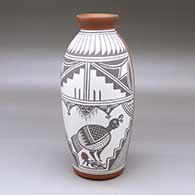 A tall polychrome jar decorated with a two panel turkey, bison and geometric design
 by John Montoya of Sandia