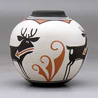 A small polychrome jar with a raised rim and a four panel deer with heart line and geometric design, click or tap to see a larger version