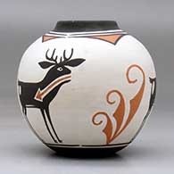 A small polychrome jar with a raised rim and a four panel deer with heart line and geometric design, click or tap to see a larger version