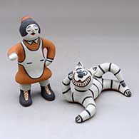 A woman with her Cheshire cat
 by Martha Arquero of Cochiti