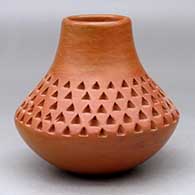 A red jar with a short neck and a band of corrugation between the shoulder and the neck
 by Verna Nahee of Hopi